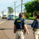 back view of police officers standing on a street